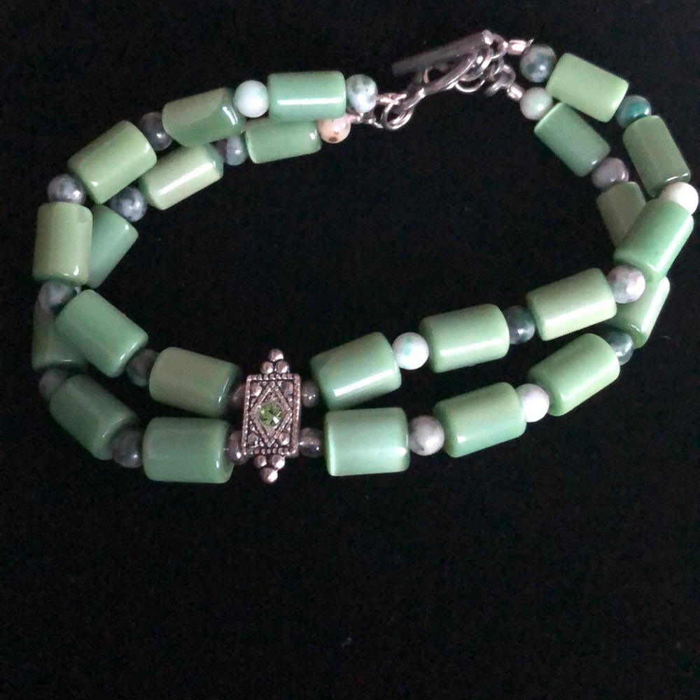 Jade bracelet with rhinestone center . Antique